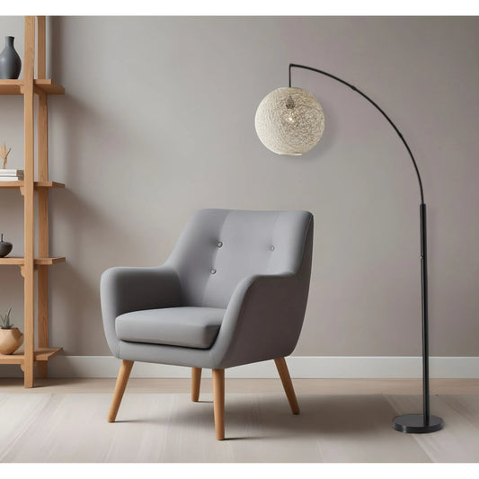 Antiqued Bronze Arched Floor Lamp with Wicker Shade